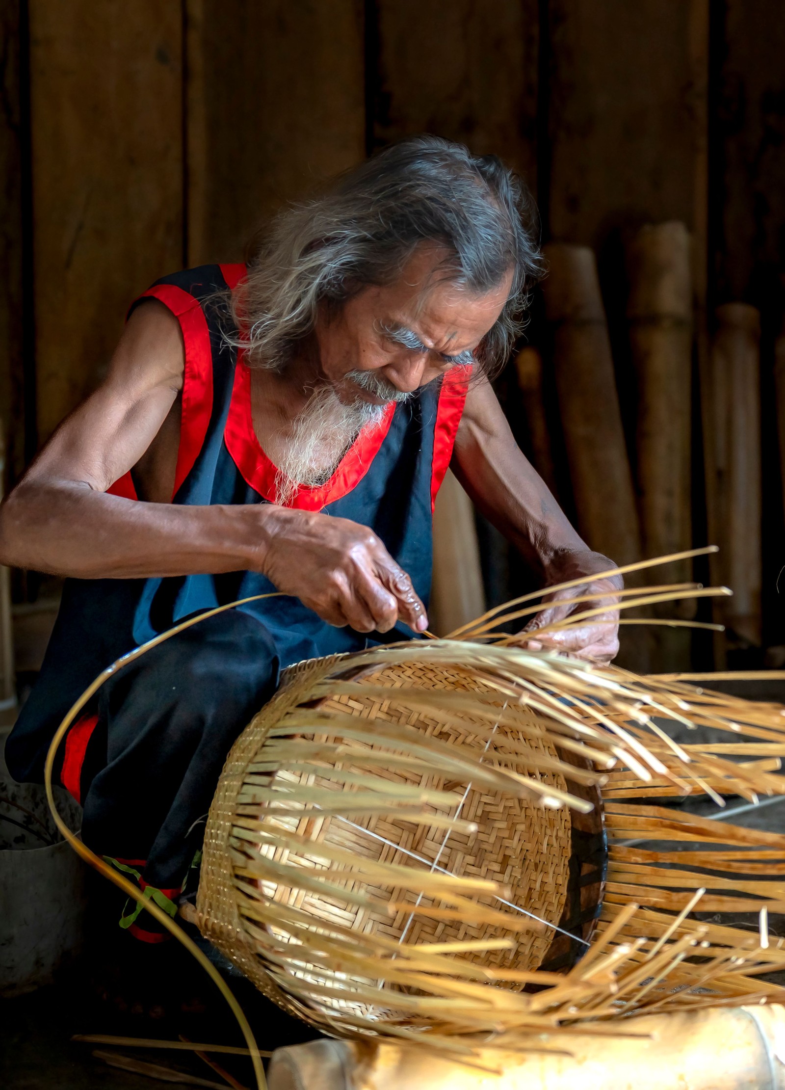 An artisan weaving a basket