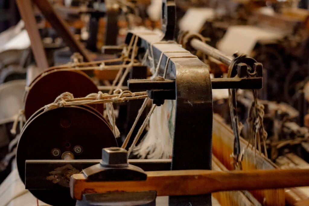 Close-up of threading on an antique weaving loom